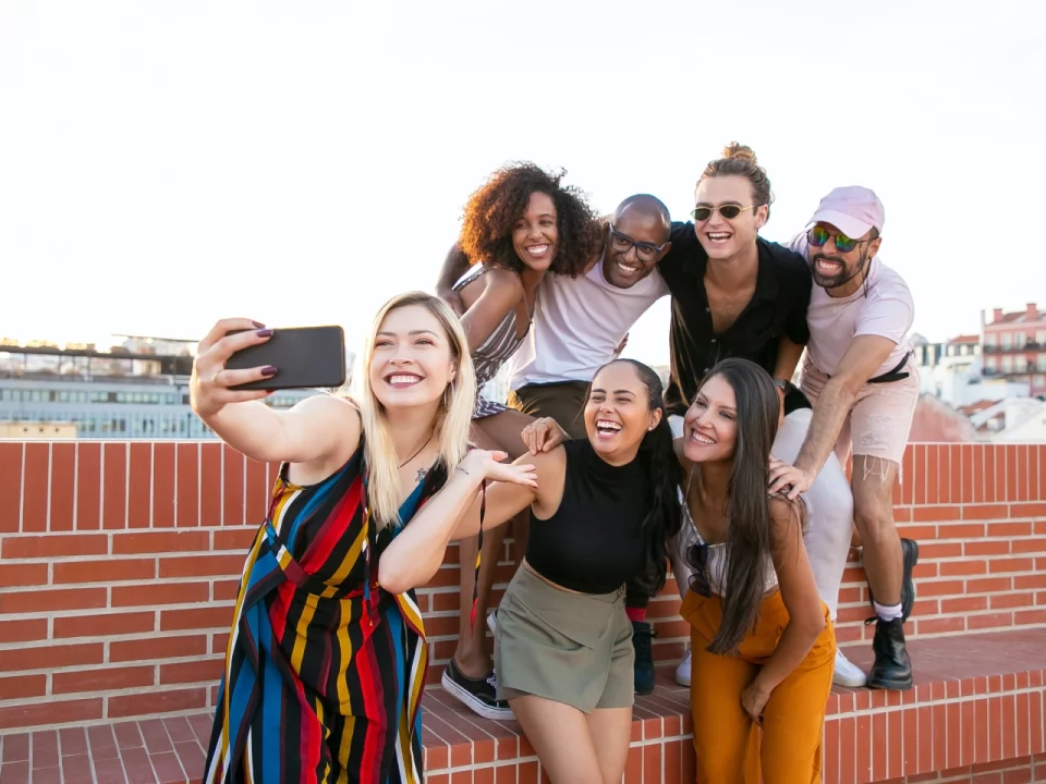 A group of people posing for a selfie